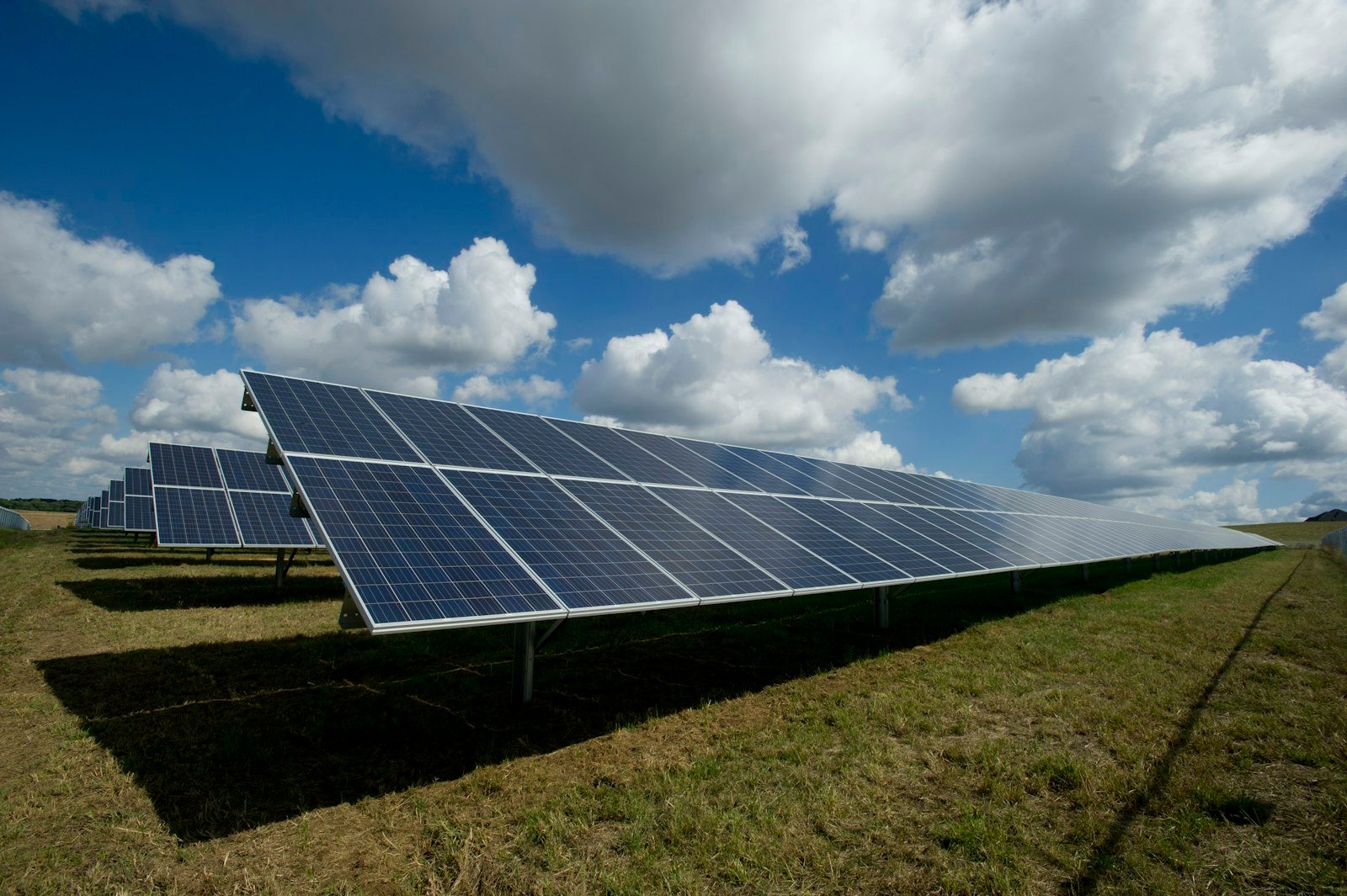 Solar panels under a bright blue sky